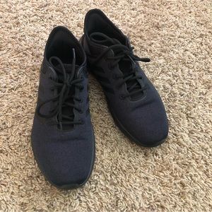 Black adidas athletic shoes